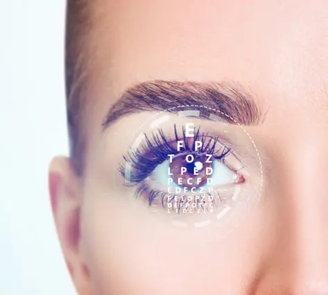 A woman with long eyelashes and blue eyes.